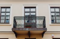Kaboompics - Historic Facade with Decorative Iron Balcony