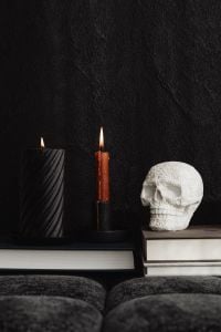 Kaboompics - White Skull Beside Black and Red Candles