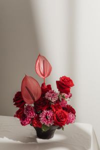 Kaboompics - Red and Pink Flower Bouquet with Anthuriums in a Black Vase