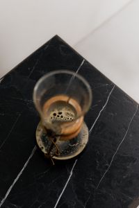Kaboompics - Overhead Glass Chemex Coffee Brewer on Black Slate Table
