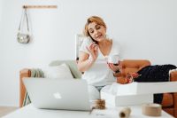 Kaboompics - Home-Based Boutique Seller Handling Customer Calls Between Orders