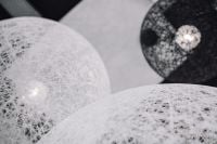 Kaboompics - Overlapping White and Black Woven Orb Pendant Lights
