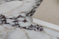 Kaboompics - Close-Up of Marble Coffee Table and Beige Fabric Book