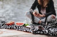 Kaboompics - Blonde woman having a healthy snack at the wooden pier