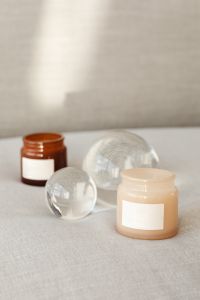 Kaboompics - Two Candle Jar Mockups and Glass Orbs with Neutral Copy Space