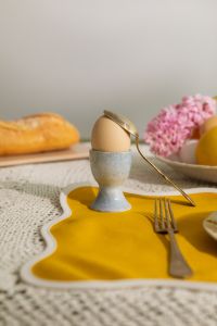 Kaboompics - Easter Egg in Blue Ceramic Cup with Spoon and Pink Hyacinth