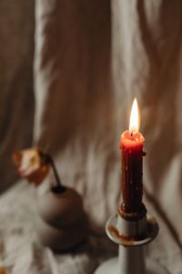 Kaboompics - Moody Candlelight Still Life With Ceramic Vase And Linen