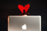 Kaboompics - Funny Christmas Desk Scene: Reindeer Antlers Peeking Above a Laptop