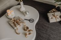 Kaboompics - Wrapped Gift and Ribbon on a Minimal Coffee Table