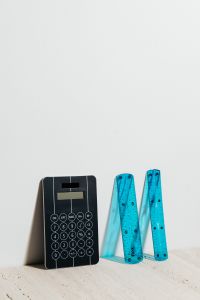 Kaboompics - Black Calculator with Blue Rulers and Generous Copy Space for Math Study and Homework