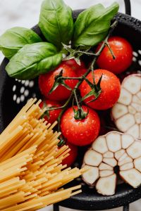 Kaboompics - Portrait Flat Lay of Spaghetti, Tomatoes, Basil and Garlic