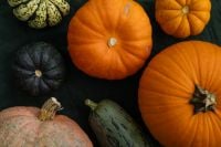 Kaboompics - Autumn Pumpkin Flat Lay With Orange Green and Black Pumpkins
