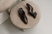Kaboompics - Brown Leather Shoes on Round Beige Stool