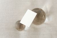 Kaboompics - Landscape Brand Card Mockup Framed by Clear Glass Orbs