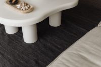 Kaboompics - White Sculptural Coffee Table with Decorative Tray