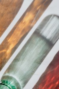 Kaboompics - Soft Amber and Sage Glass Texture with Diagonal Light