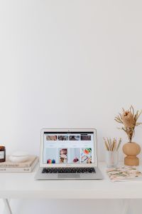 Kaboompics - Laptop Workspace with Dried Flowers and Large White Copy Space