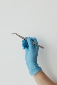 Kaboompics - Vertical Dental Tweezers With White Copy Space