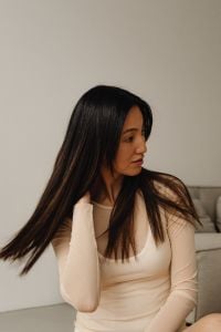 Kaboompics - Close-Up Side Profile of a Woman with Long Dark Hair in Soft Daylight