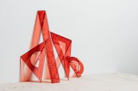 Kaboompics - Red Geometry Tools Arranged on a Neutral Surface for Classroom Learning and Math Lessons