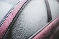 Kaboompics - Frost on a red car