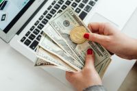 Kaboompics - US Dollar Bills and Bitcoin Coin by Laptop