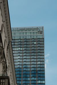 Kaboompics - Modern Glass Tower Between City Buildings