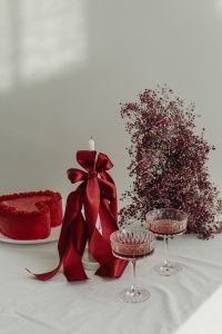 Kaboompics - Valentine Heart Cake with Bow Candle, Flowers and Pink Cocktails