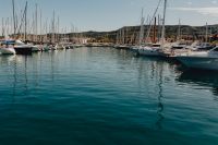Kaboompics - Open Blue Water Framed by Moored Boats in the Marina