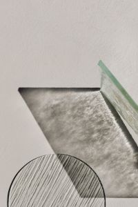 Kaboompics - Round Ribbed Glass Surface Casting Patterned Shadows on Neutral Ground