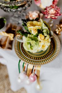 Kaboompics - Decorative Floral Teacup with Gold Bunny Figurines and Patterned Easter China