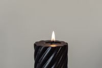 Kaboompics - Black Spiral Candle Against Gray Wall, Minimal Moody Background with Copy Space
