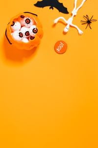 Kaboompics - Vertical Halloween Candy and Skeleton Flat Lay