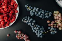 Kaboompics - Flat Lay of Raspberries and Mixed Grapes