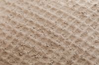 Kaboompics - Beige Plaster Texture with Granular Raised Details and Soft Neutral Color