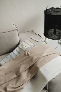Kaboompics - Neutral Fabric Samples Draped Across a Sofa