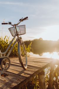 Kaboompics - Bicycle with basket on the pier in bright sunset light