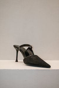 Kaboompics - Black Woven Pointed Heel on White Display Shelf