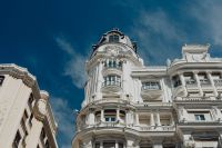 Kaboompics - Wide Low-Angle Madrid Architecture with Ornate White Facades and Blue Sky