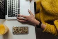 Kaboompics - Overhead Home Office with Laptop, Gold-Patterned Smartphone and Orange Juice