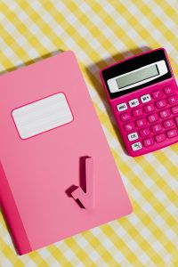 Kaboompics - Vertical Close-Up of a Pink Notebook and Calculator
