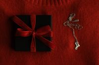 Kaboompics - Black Gift Box with Red Ribbon and Silver Necklace