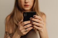 Kaboompics - Close-Up of Woman Using a Smartphone in Yoga Clothes