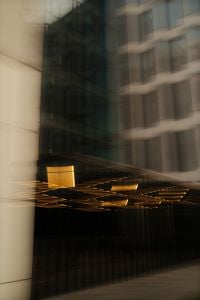 Kaboompics - Modern Glass Building with Golden Reflections and Motion Blur