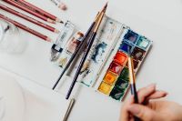 Kaboompics - A woman paints with watercolors