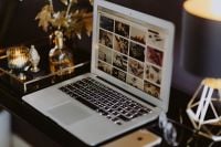 Kaboompics - Close-Up Home Office Setup with Laptop, Smartphone and Gold Lamp