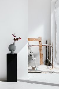 Kaboompics - Flower Vase in a Bright Studio beside a Wooden Stool