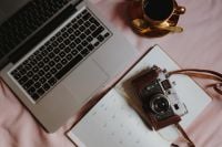 Kaboompics - Pink Couch Work Flat Lay with Laptop, Camera and Planner