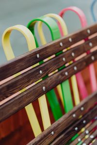 Kaboompics - Vertical Detail of a Colorful Loop-Back Bench with Wooden Slats at Manufaktura, Łódź