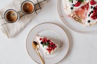 Kaboompics - A Slice of Pavlova on a Gold-Rimmed Plate beside the Whole Berry Cake